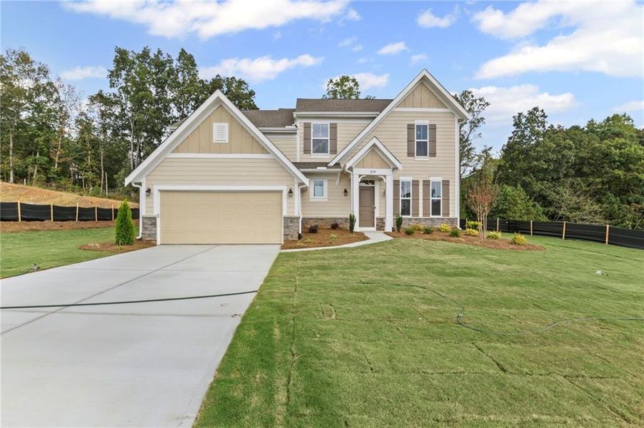 Front exterior of a new home in Pickens Bluff, Hiram, GA, highlighting curb appeal (Image 1). Front exterior of a new home in Pickens Bluff, Hiram, GA, highlighting curb appeal (Image 1).