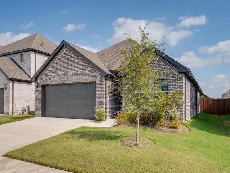 Front exterior of a new home in Southridge - Signature Series, McKinney, TX, highlighting curb appeal (Image 2). Front exterior of a new home in Southridge - Signature Series, McKinney, TX, highlighting curb appeal (Image 2).