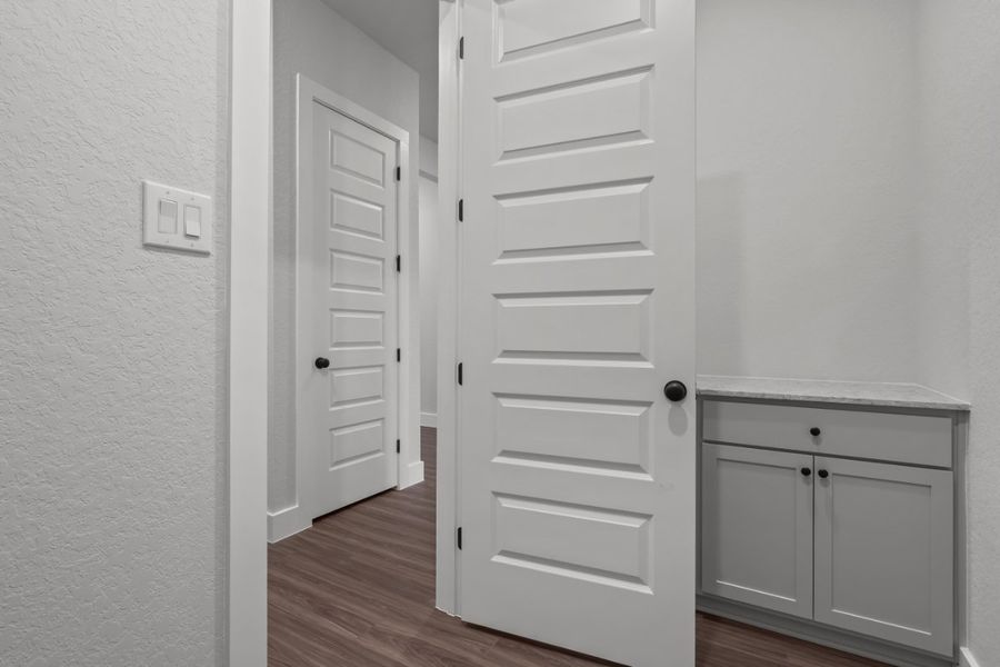 A white door in a room. A white door in a room.