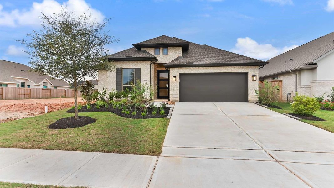 Front exterior of a new home in Candela, Richmond, TX, highlighting curb appeal (Image 2). Front exterior of a new home in Candela, Richmond, TX, highlighting curb appeal (Image 2).