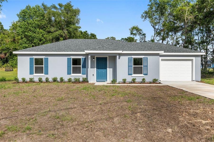 Front exterior of a new home in , Ocala, FL, highlighting curb appeal (Image 15).