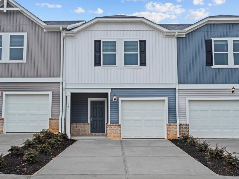 Front exterior of a new home in Northbrook Village Townes, Taylors, SC, highlighting curb appeal (Image 1).