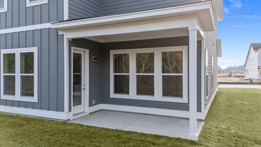 Exterior details and patio area of a home in Blue Heron Retreat, Little River (Image 3).