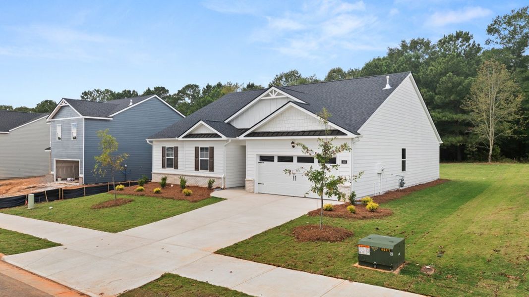 Front exterior of a new home in Preserve at Dove Creek, Statham, GA, highlighting curb appeal (Image 2).