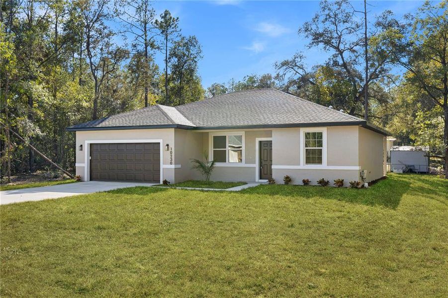 Front exterior of a new home in , Citrus Springs, FL, highlighting curb appeal (Image 23).