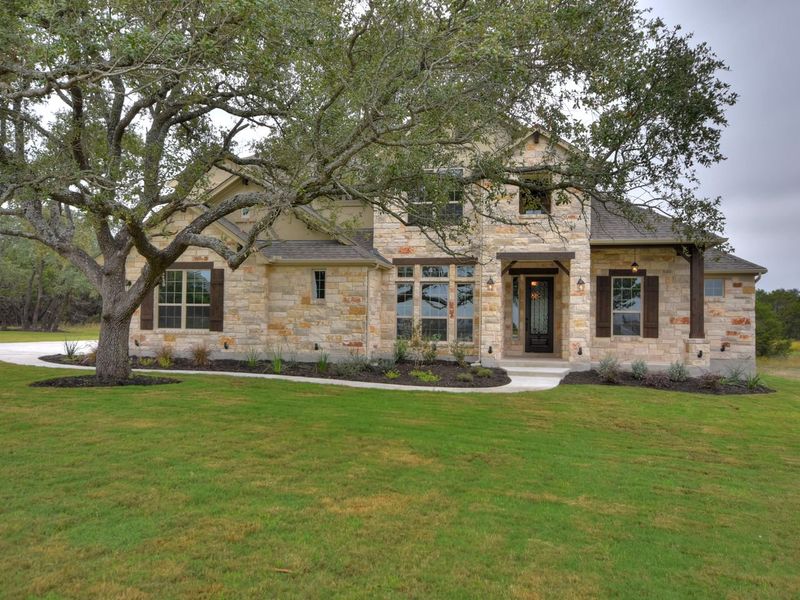 Representative exterior photo of a completed home built from the Madera II by Giddens Homes in Scofield Farms Estates, Georgetown, TX (Image 55).