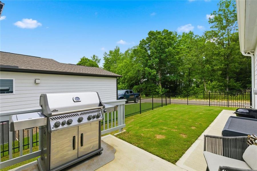 Exterior details and patio area of a home in Marble Tree, Ball Ground (Image 3).