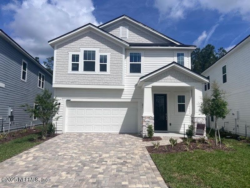 Front exterior of a new home in Brook Forest, St. Augustine, FL, highlighting curb appeal (Image 1). Front exterior of a new home in Brook Forest, St. Augustine, FL, highlighting curb appeal (Image 1).