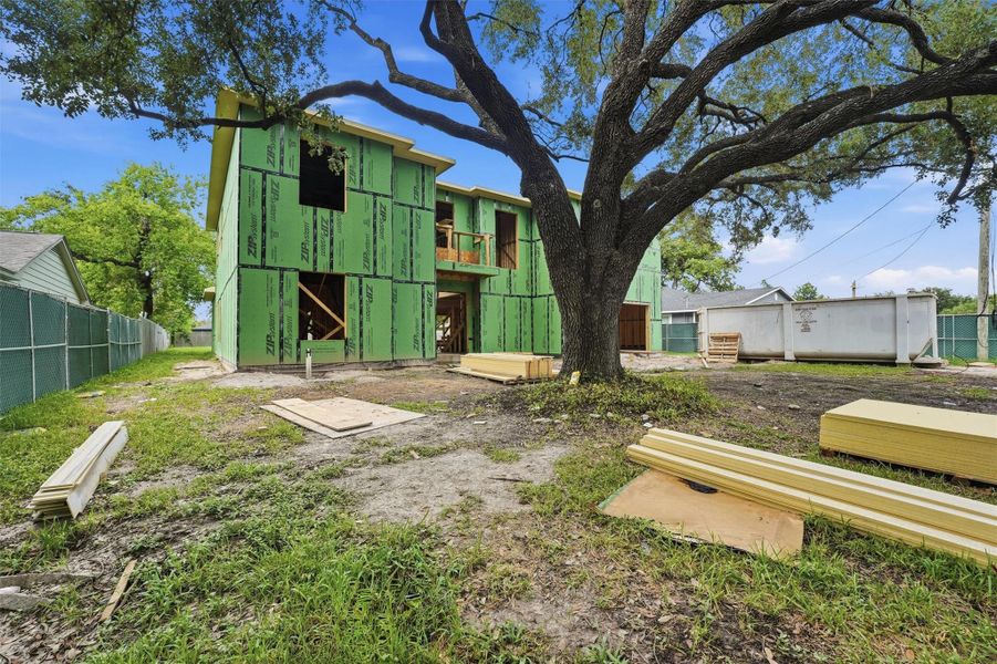 Front Elevation - Mature oak tree and expansive homesite Front Elevation - Mature oak tree and expansive homesite
