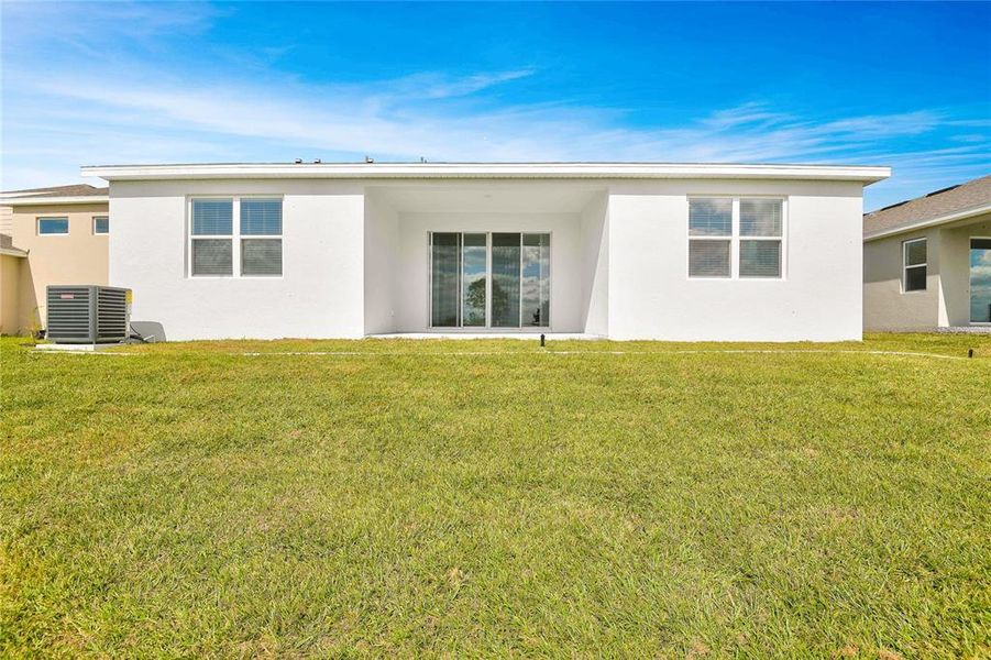 Exterior details and patio area of a home in Seasons at Bella Vista, Dundee (Image 4).