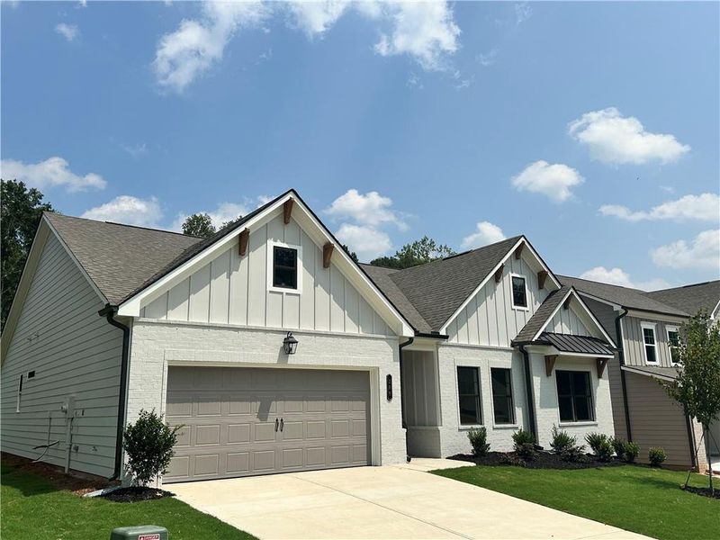 Front exterior of a new home in Summerlin, Winder, GA, highlighting curb appeal (Image 21).