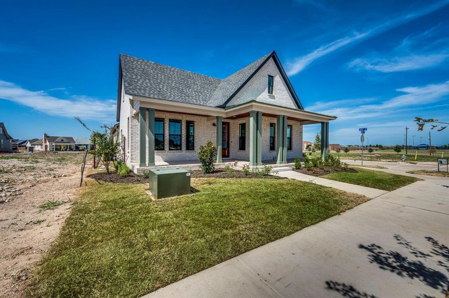 Front exterior of a new home in , Midlothian, TX, highlighting curb appeal (Image 18).