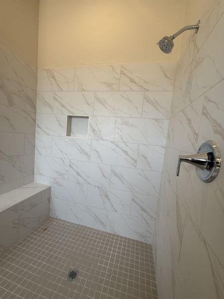 Bathroom with tiled shower