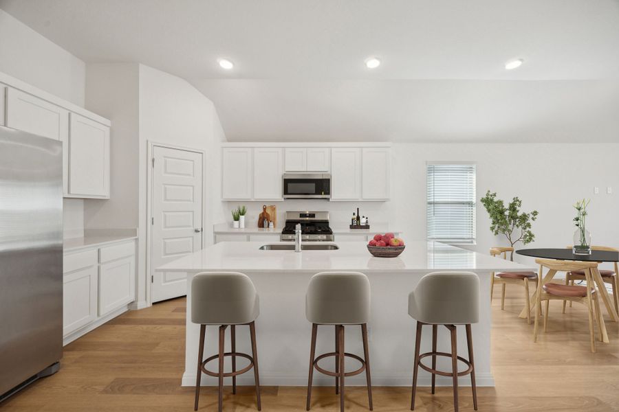 Kitchen in the Redbud home plan by Trophy Signature Homes - REPRESENTATIVE PHOTO