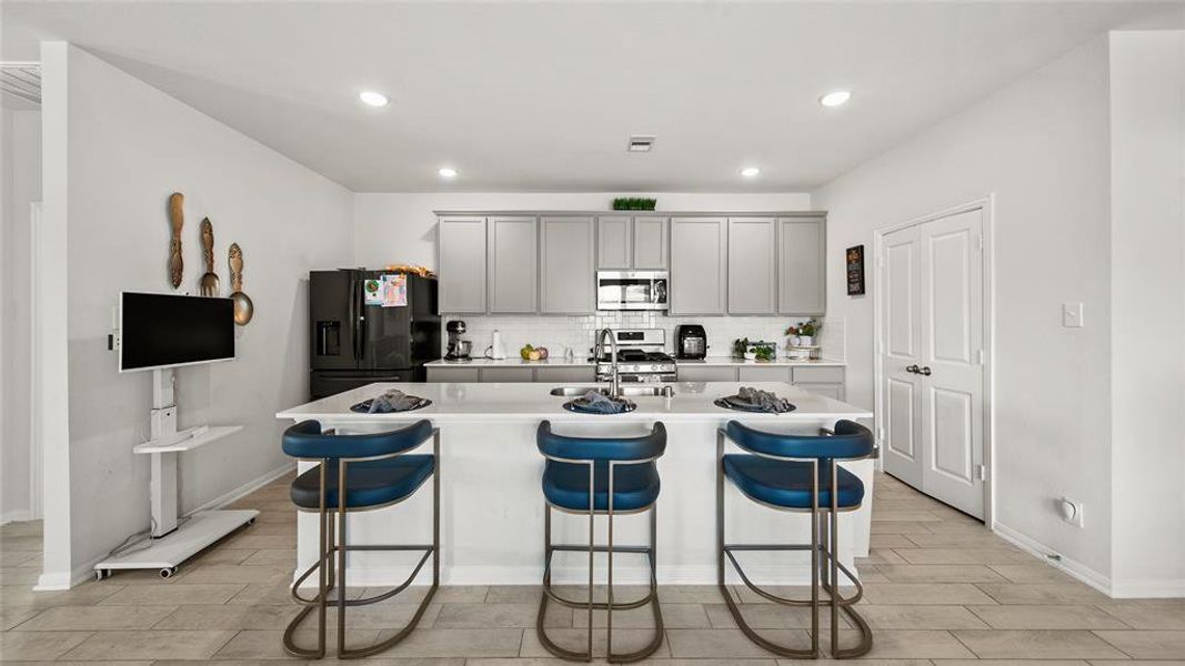 Open Kitchen concept with Granite bar top.