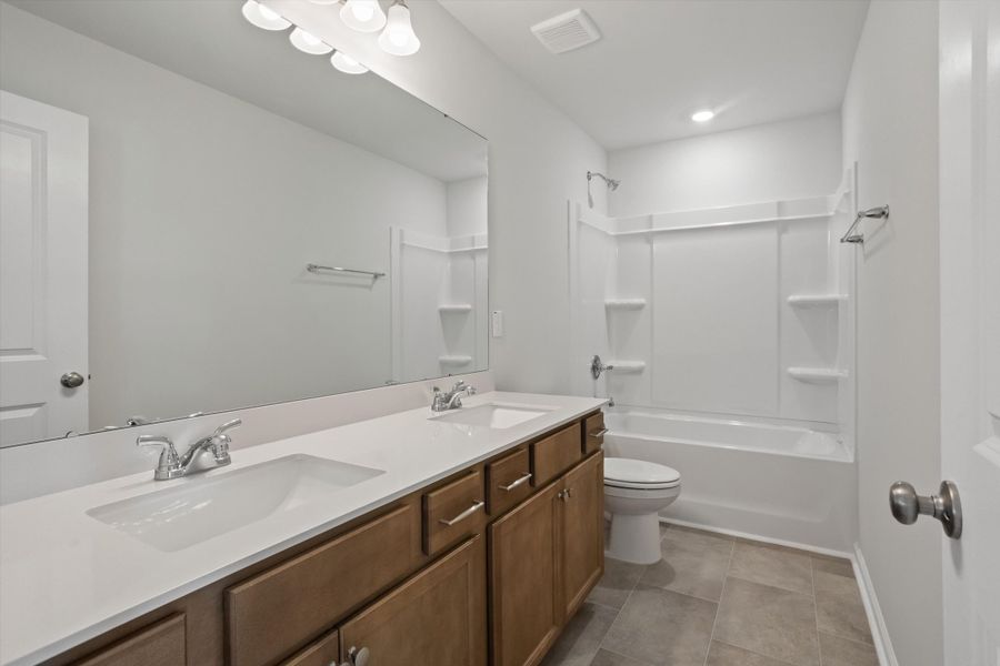 Furnished interior view inside a new home in Cambridge Reserve, Angier (Image 9).