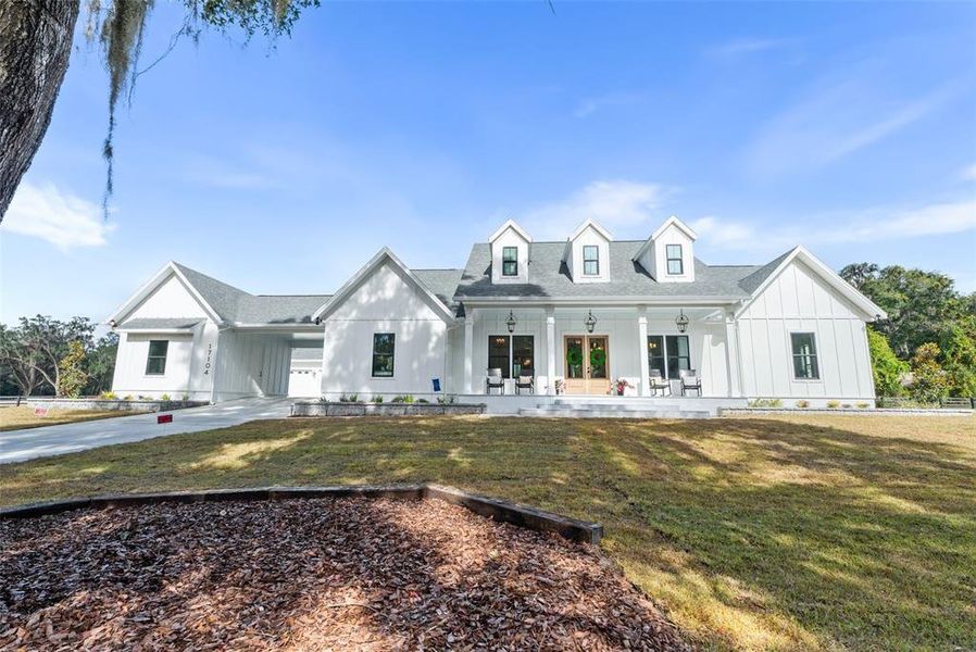 Front exterior of a new home in , Newberry, FL, highlighting curb appeal (Image 24). Front exterior of a new home in , Newberry, FL, highlighting curb appeal (Image 24).