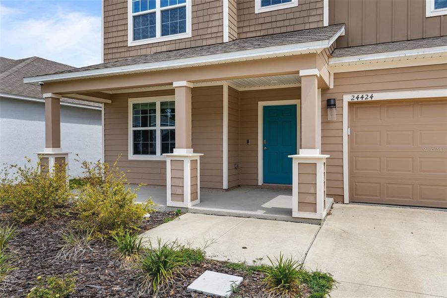 Front exterior of a new home in Avalon Woods, Newberry, FL, highlighting curb appeal (Image 2).