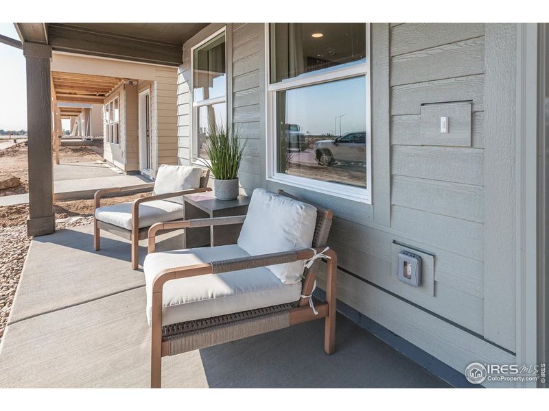 Exterior details and patio area of a home in Prairie Song Cottages, Windsor (Image 4).