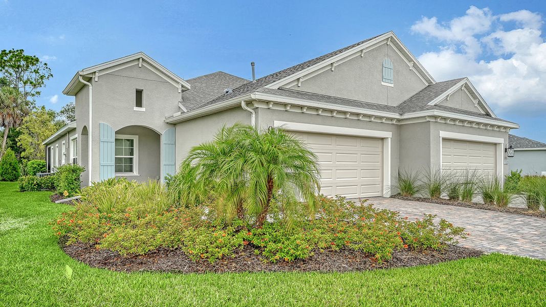 Front exterior of a new home in Wildleaf Real Estate and Homes for Sale in Parrish, FL - Neal Communities, Parrish, FL, highlighting curb appeal (Image 1). Front exterior of a new home in Wildleaf Real Estate and Homes for Sale in Parrish, FL - Neal Communities, Parrish, FL, highlighting curb appeal (Image 1).