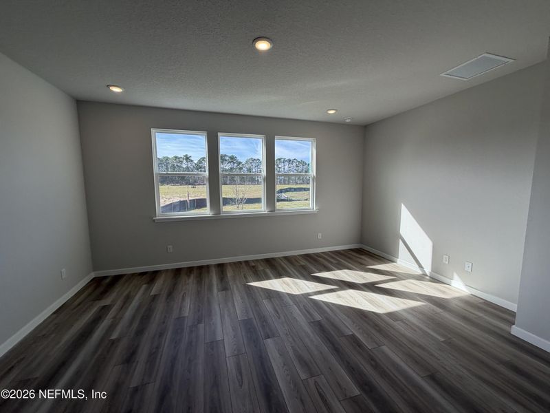 Spacious, unfurnished interior of a new home in The Cypress Series at Reserve East, Flagler Beach (Image 23).