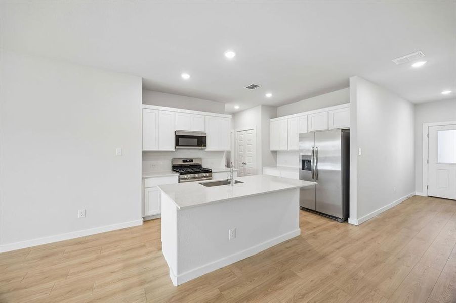 Kitchen in the Mesquite home plan by Trophy Signature Homes – REPRESENTATIVE PHOTO