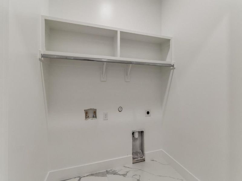 Laundry area featuring electric dryer hookup, washer hookup, hookup for a gas dryer, and marble look tile flooring