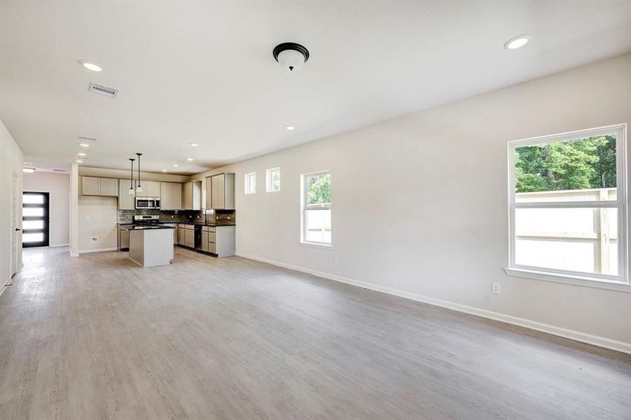 The Davenport II- Family Room into Dining Area and Kitchen