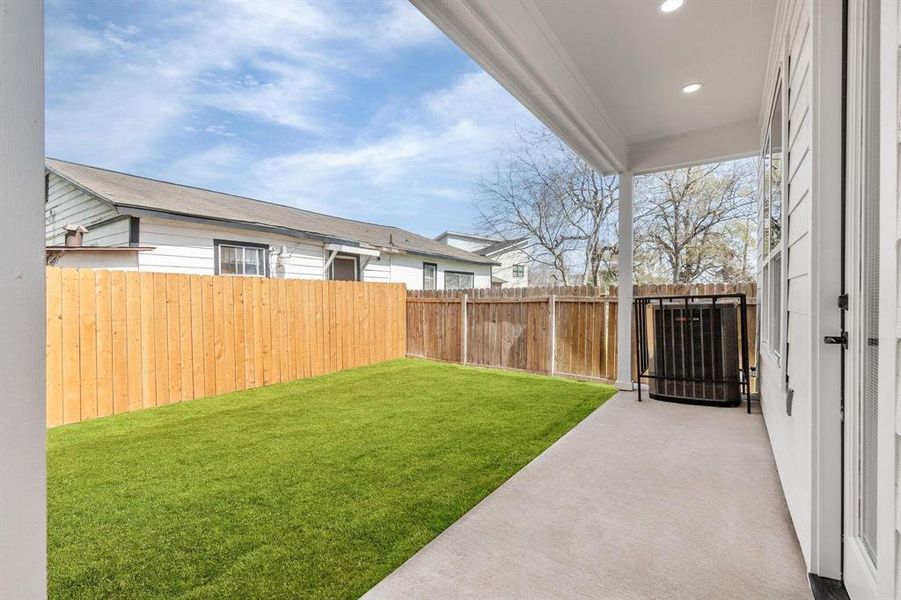 View of the backyard space from the back patio.