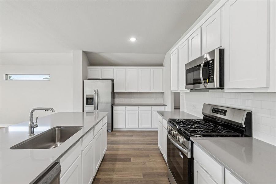 Kitchen in the Heisman home plan by Trophy Signature Homes – REPRESENTATIVE PHOTO Kitchen in the Heisman home plan by Trophy Signature Homes – REPRESENTATIVE PHOTO