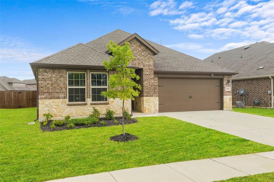 Front exterior of a new home in , Aubrey, TX, highlighting curb appeal (Image 23).