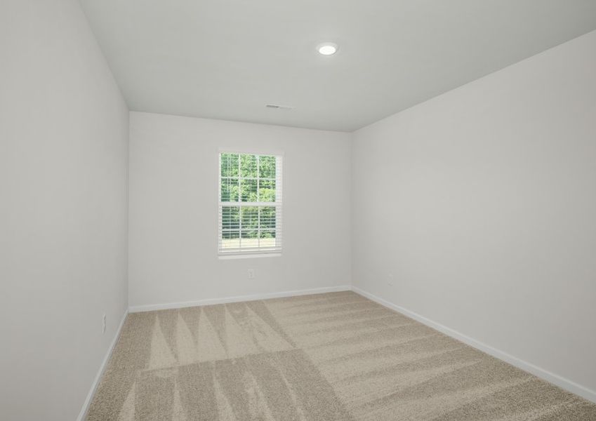 One of two secondary bedrooms that includes lush carpeting and recessed lighting One of two secondary bedrooms that includes lush carpeting and recessed lighting