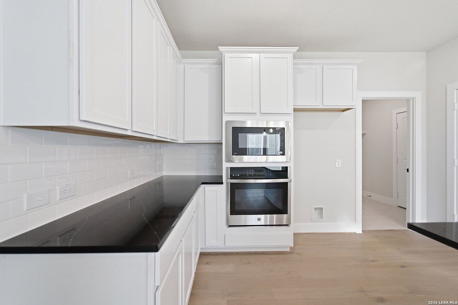 Furnished interior view inside a new home in The Woodlands at Medina Hills, Mico (Image 16).