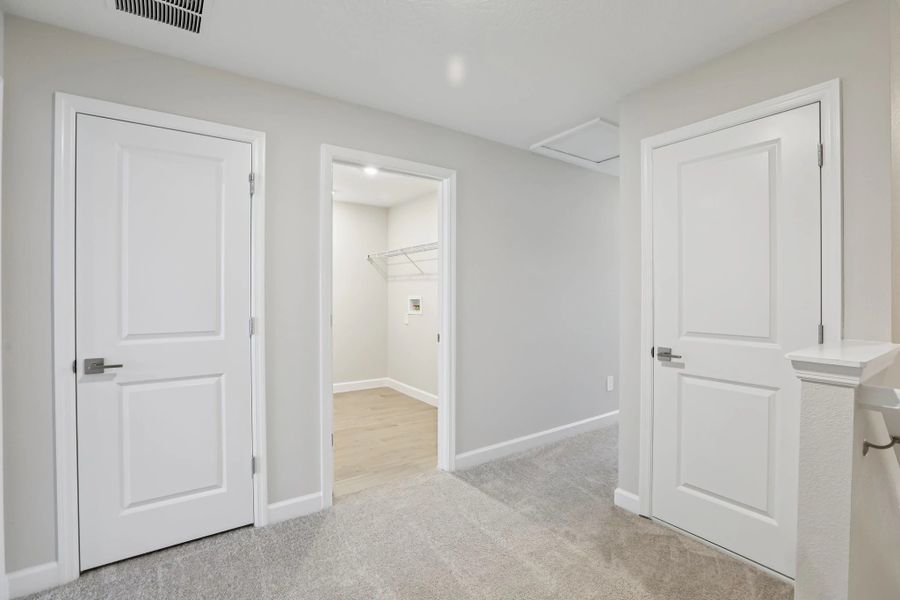 Staircase opens up into versatile second-floor loft space