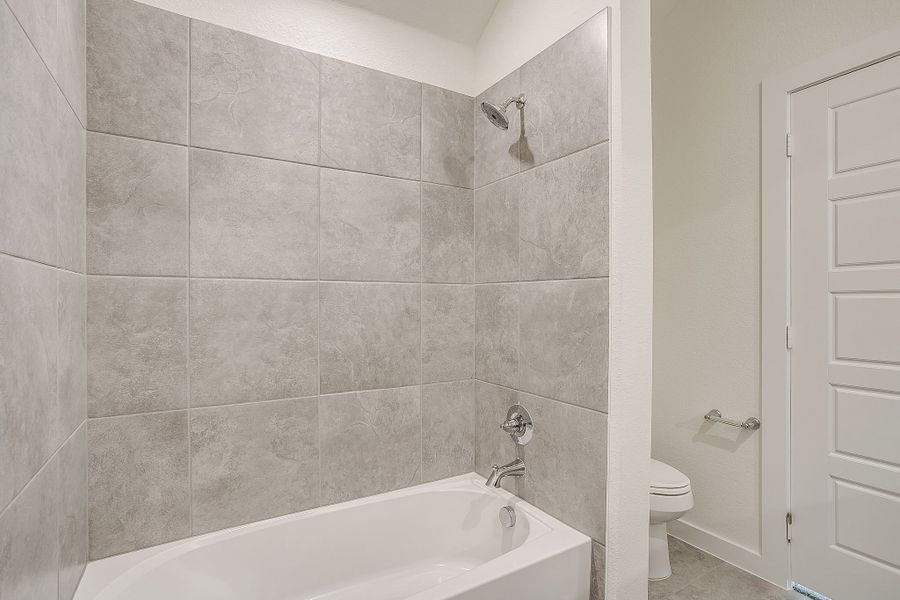 Representative furnished interior of a home built from the Palmer by Graham Hart Home Builder in Bear Ridge, Burleson (Image 13).
