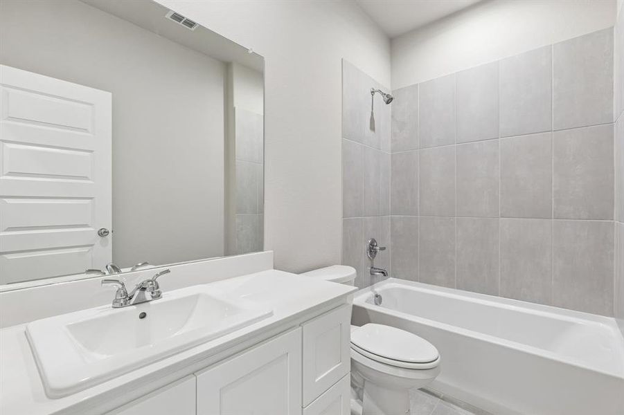 Bathroom in the Holden home plan by Trophy Signature Homes – REPRESENTATIVE PHOTO Bathroom in the Holden home plan by Trophy Signature Homes – REPRESENTATIVE PHOTO