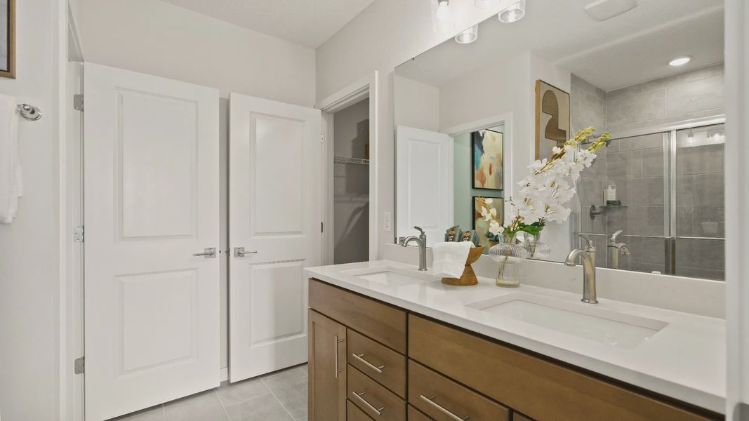 Castaway Model Home Primary Suite, en suite bath with dual sinks new home plan available at Liberty Trace in Haines City, fl