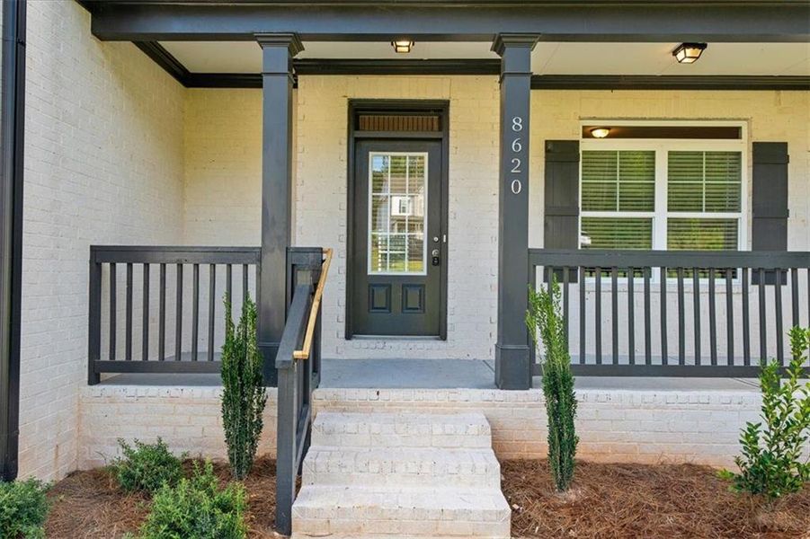 Front exterior of a new home in River Rock, Ball Ground, GA, highlighting curb appeal (Image 24).