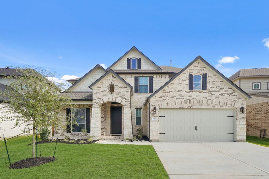 Front exterior of a new home in Morton Creek Ranch, Katy, TX, highlighting curb appeal (Image 14).