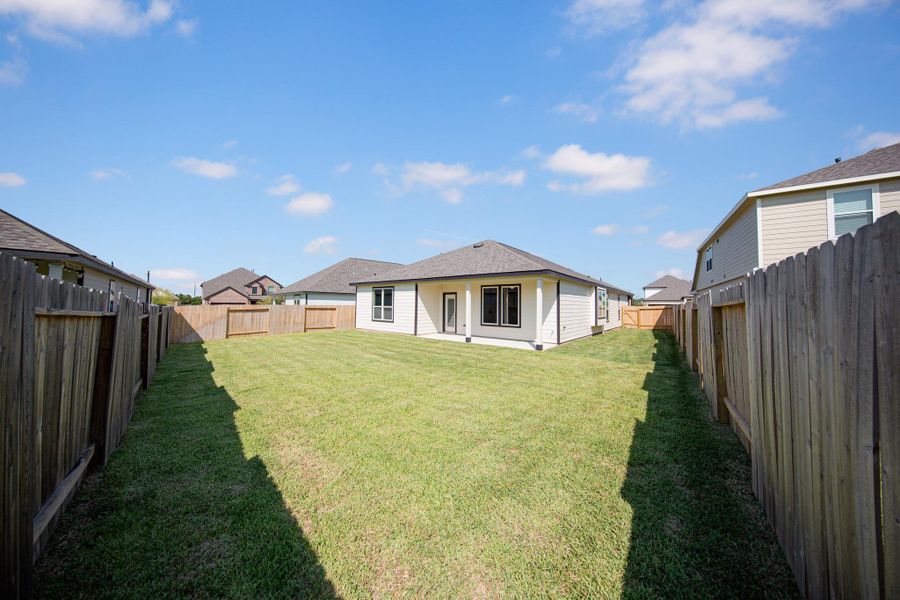 Exterior details and patio area of a home in Bluestem, Brookshire (Image 3).