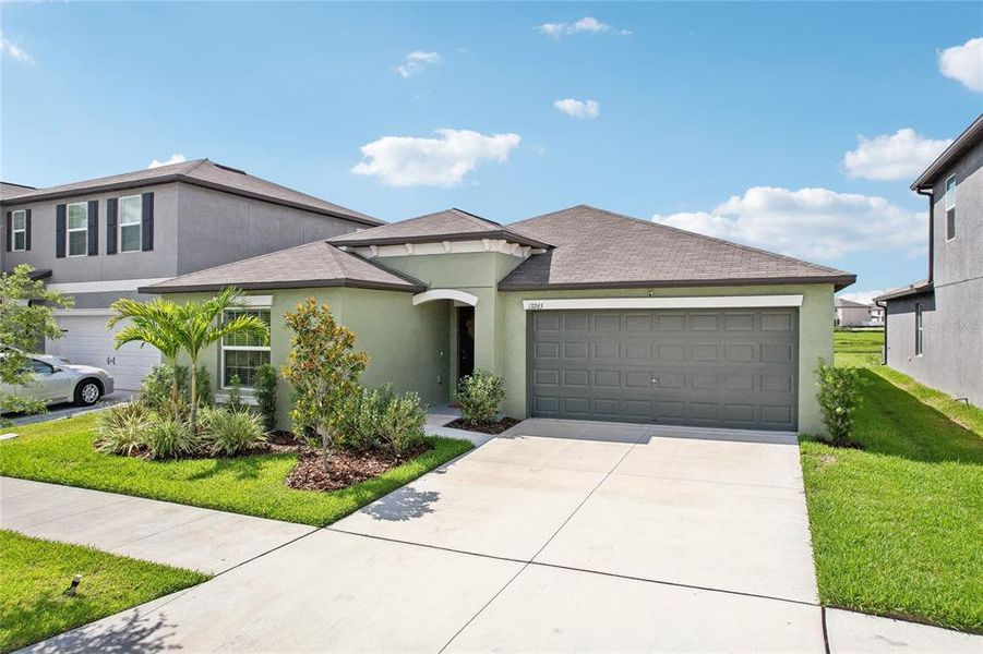 Front exterior of a new home in , Riverview, FL, highlighting curb appeal (Image 24).