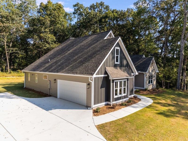 Front exterior of a new home in LOVVORN ESTATES, Carrollton, GA, highlighting curb appeal (Image 27).