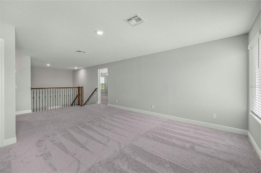 Spacious, unfurnished interior of a new home in Gum Lake Preserve, Lake Alfred (Image 29).