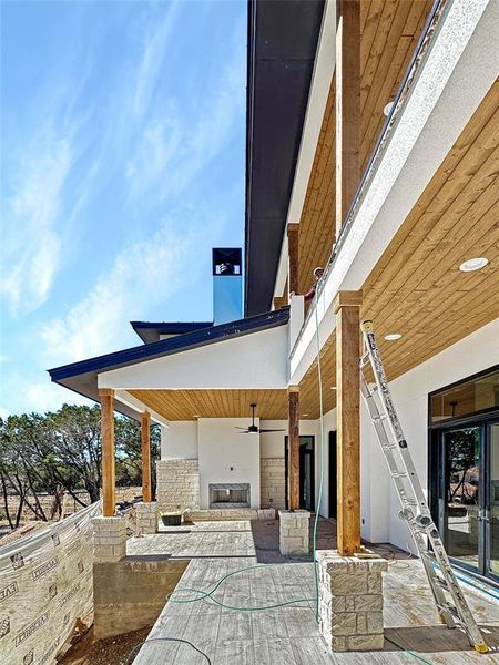 Step into the anticipation of outdoor opulence with the under-construction back patio. The meticulous craftsmanship is evident in the custom wood planked ceilings and the artful tiling that graces the floor. A thoughtful touch awaits with a designated area, pre-equipped with gas lines, inviting you to personalize your outdoor kitchen dreams. This space is a canvas in the making, promising to be a seamless extension of refined living.