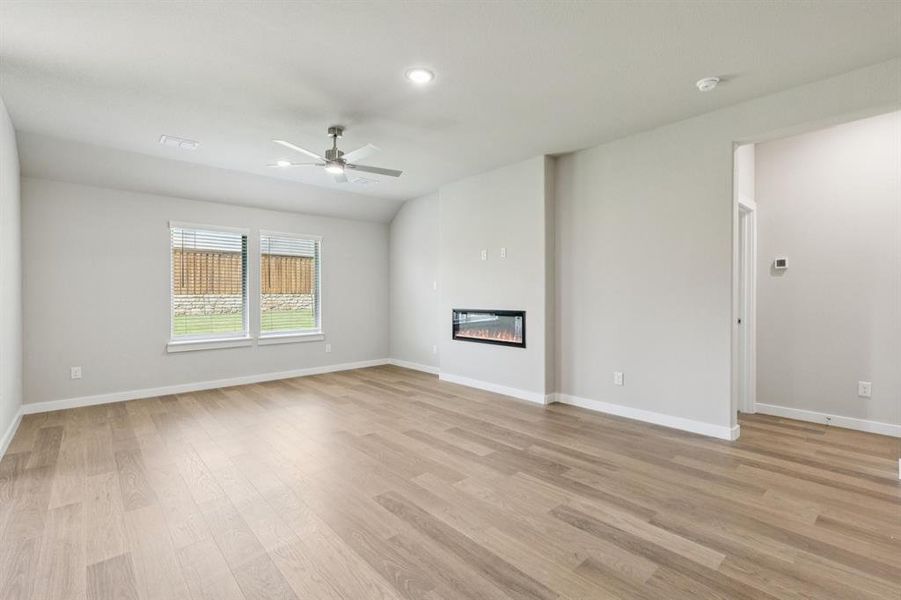 Living room in the Heisman home plan by Trophy Signature Homes – REPRESENTATIVE PHOTO