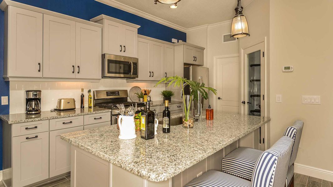 Representative furnished interior of a home built from the Endless Summer 4 by Neal Communities in Boca Royale Golf & Country Club at Wellen Park, Englewood (Image 10).