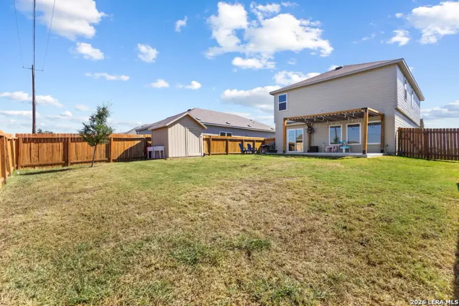 Exterior details and patio area of a home in Legend Pond, New Braunfels (Image 27).