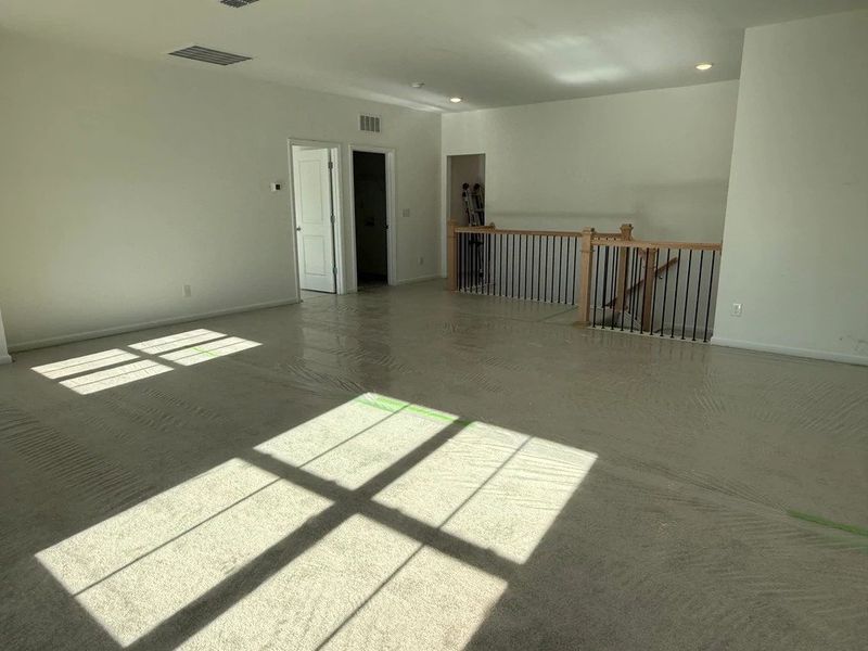 Loft featuring the AW Collection® Coastal - Flexible open space filled with natural light.