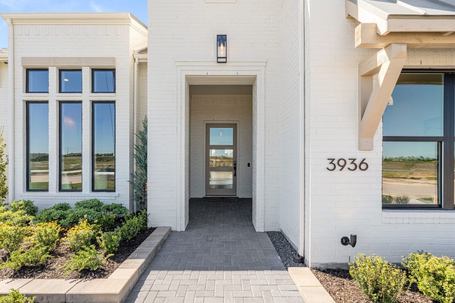 Representative exterior details of a home built from the 6051 by Tradition Homes in StarView, Prosper (Image 27).
