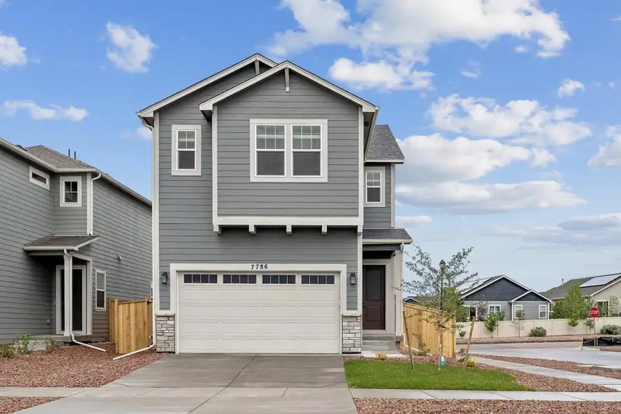 Front exterior of a new home in Aspen Meadows, Colorado Springs, CO, highlighting curb appeal (Image 1). Front exterior of a new home in Aspen Meadows, Colorado Springs, CO, highlighting curb appeal (Image 1).